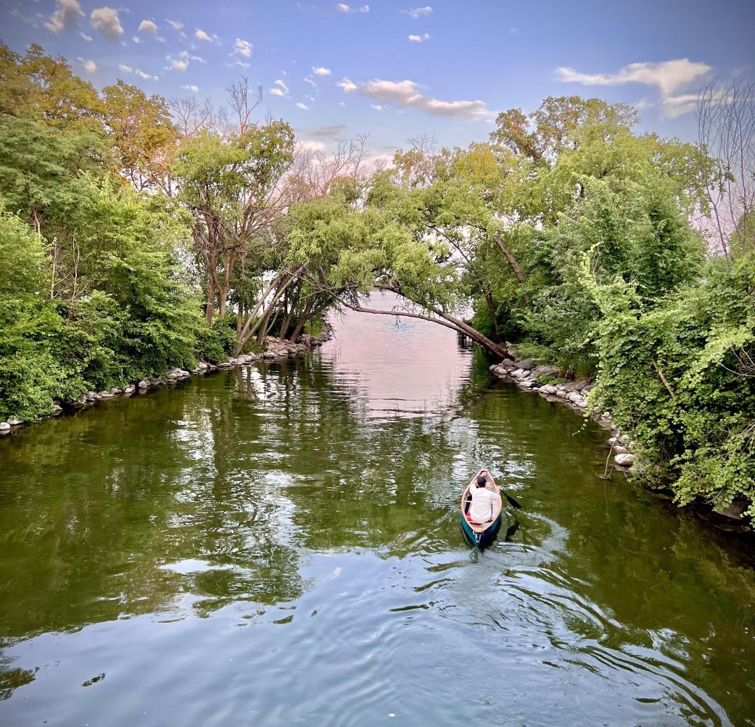 A kayak paddling down the mouth of the Yahara River